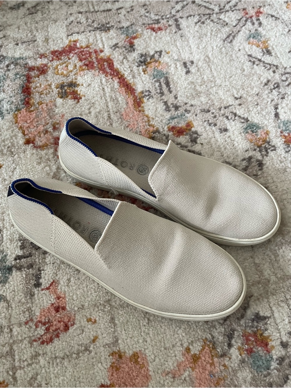 Rothy's Slip-On Sneakers in Off-White with Blue Trim